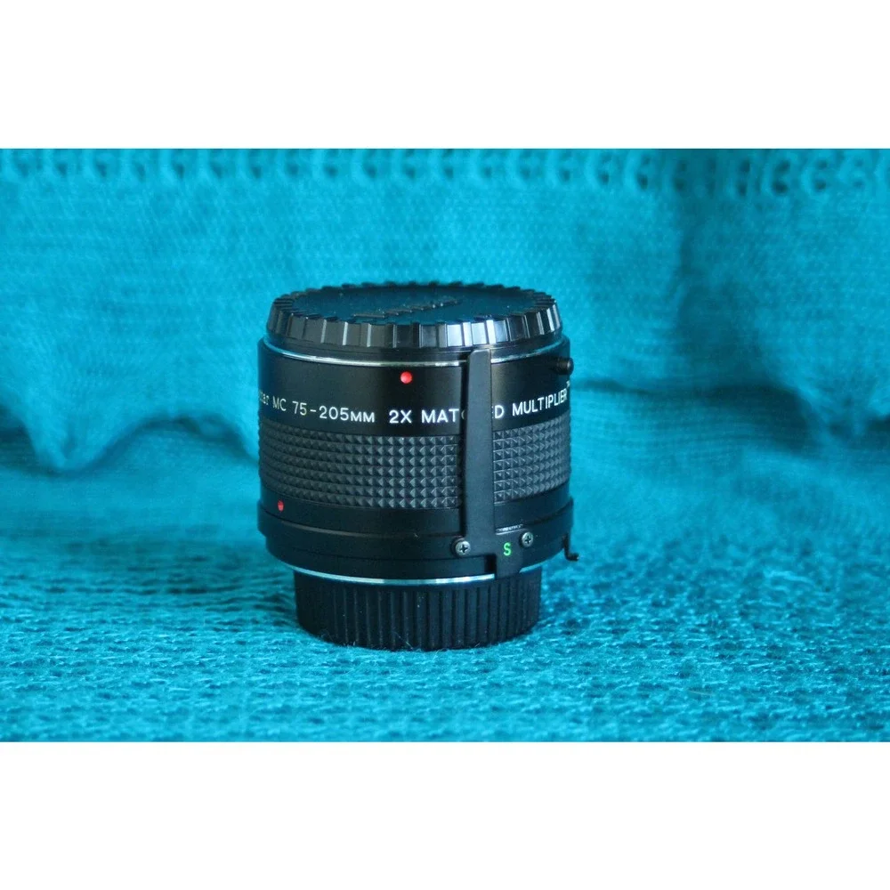 Vivitar 75-205 MM F1:3.8 Lens for Minolta MC mount with 2x converter.